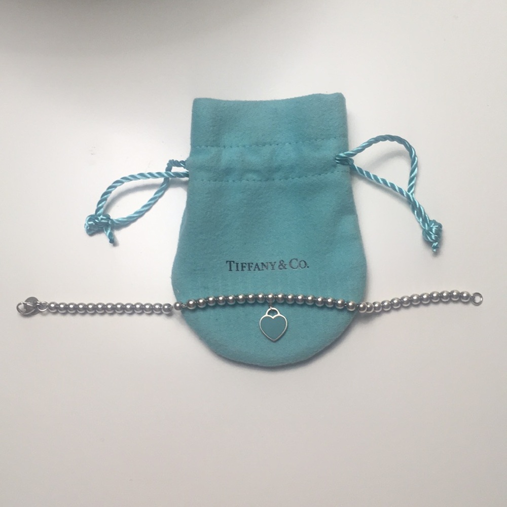 Tiffany bracelet with charm. Bag included.